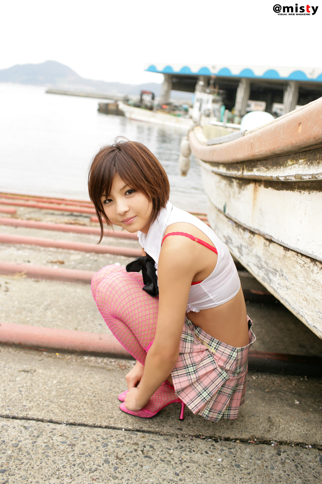 nagasaki rina, fishnet legwear, highres, photo (medium), crop top, docks, fishnets, necktie, pleated skirt, skirt, thighhighs