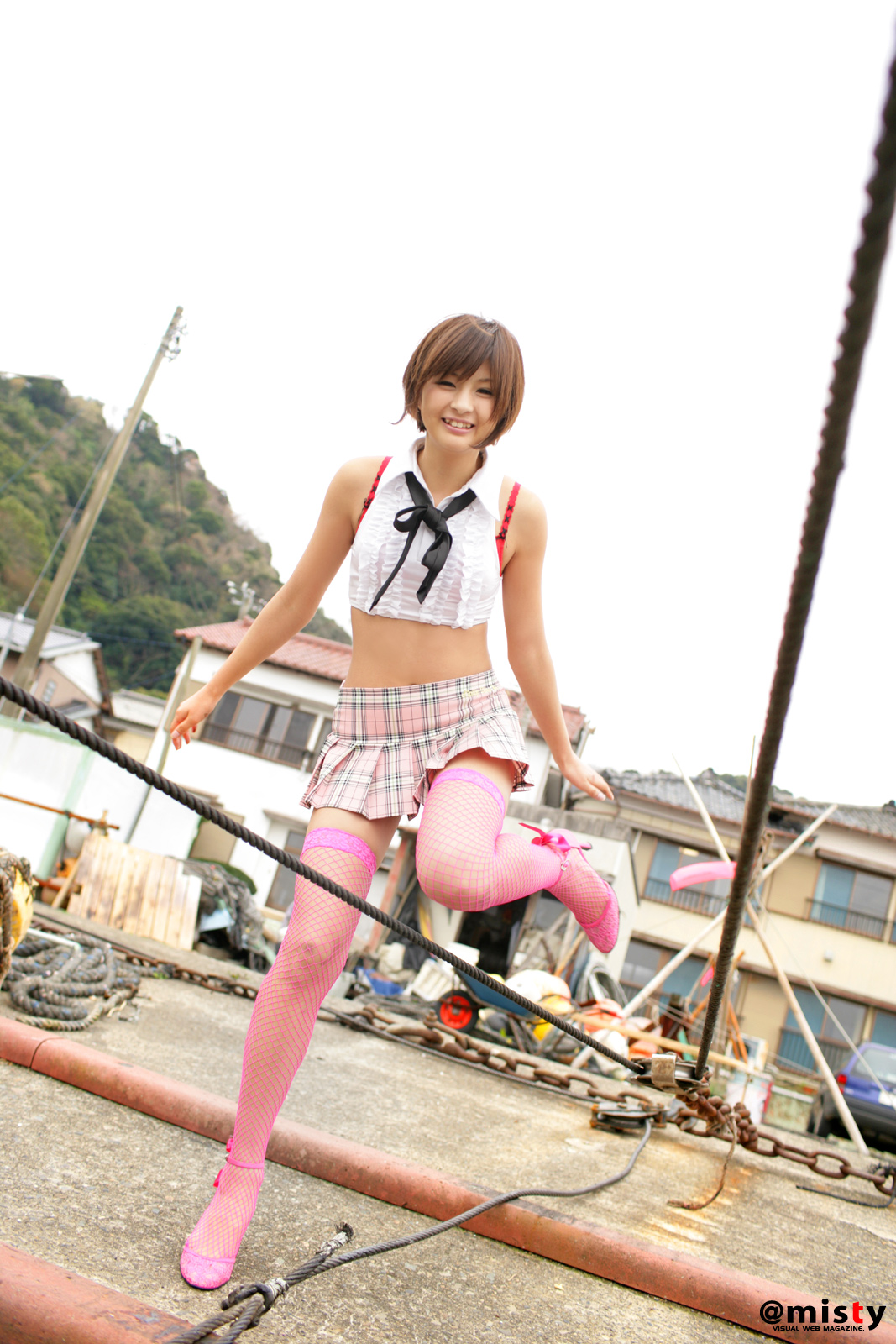 nagasaki rina, fishnet legwear, highres, photo (medium), crop top, docks, fishnets, midriff, necktie, pleated skirt, skirt, thighhighs