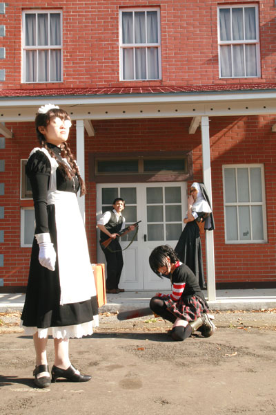 omi gibson, eda (black lagoon), frederica sawyer, ricardo (black lagoon), roberta (black lagoon), black lagoon, striped, photo (medium), 1boy, 3girls, asian, boots, braid, chainsaw, cosplay, eda (black lagoon) (cosplay), frederica sawyer (cosplay), glasses, goth fashion, gun, maid, multiple girls, nun, on one knee, outdoors, pleated skirt, punk, ricardo (black lagoon) (cosplay), roberta (black lagoon) (cosplay), skirt, thighhighs, twin braids, weapon