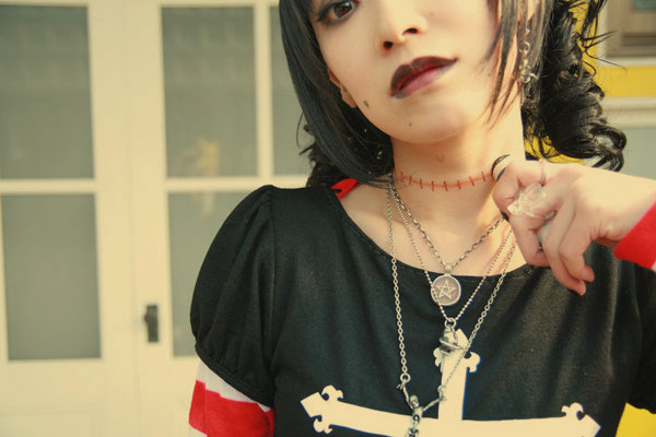omi gibson, frederica sawyer, black lagoon, striped, photo (medium), 1girl, asian, cosplay, electrolarynx, female focus, frederica sawyer (cosplay), goth fashion, looking at viewer, pleated skirt, punk, skirt, solo