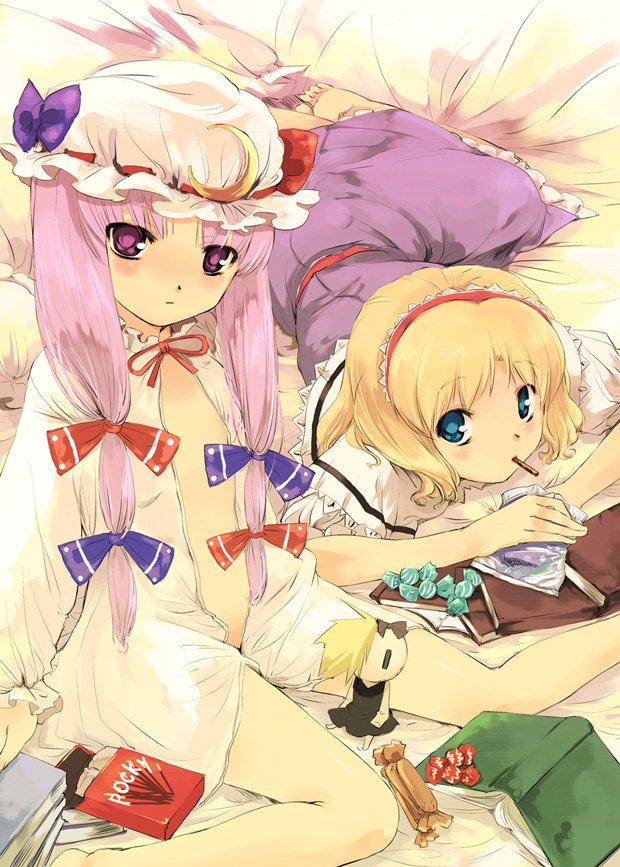 yuu (kfc), alice margatroid, patchouli knowledge, touhou, 2girls, barefoot, bed, blonde hair, blue eyes, blush, book, candy, female focus, food, looking at viewer, lying, mouth hold, multiple girls, on stomach, open clothes, pocky, purple eyes, purple hair, sitting