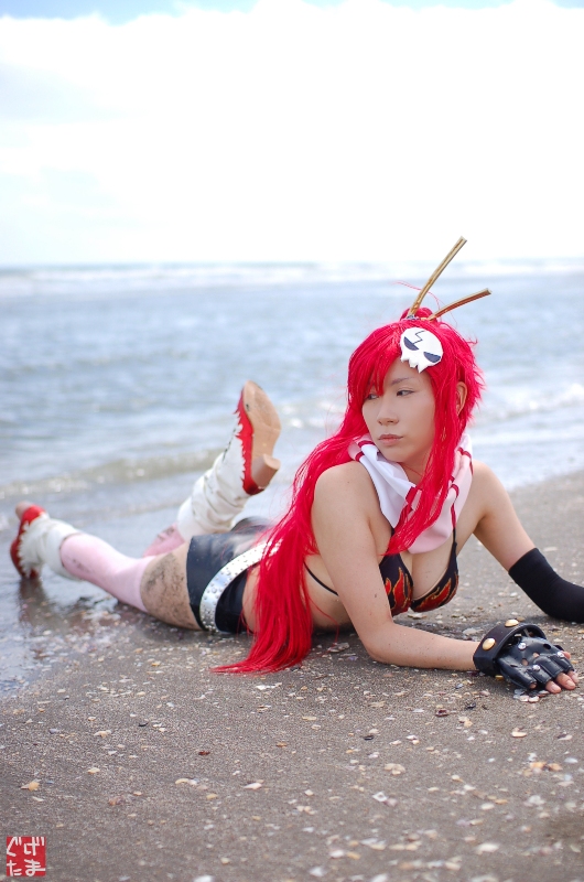 yoko littner, tengen toppa gurren lagann, photo (medium), arm warmers, beach, bikini, bikini top only, boots, breasts, chopsticks, cleavage, cosplay, fingerless gloves, gloves, kudou rou, ocean, red hair, scarf, shorts, swimsuit, thighhighs