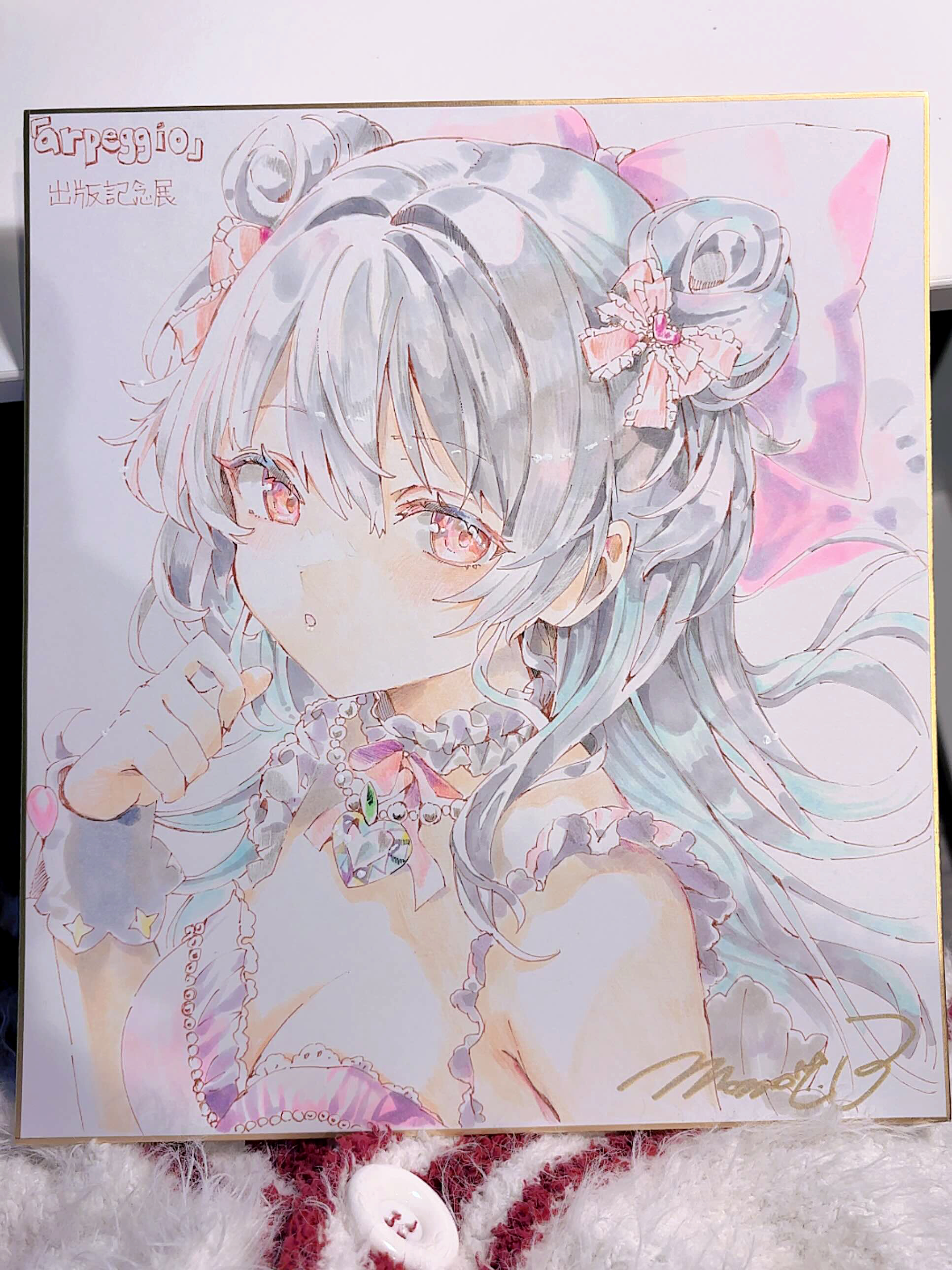 momoko (momopoco), hiyori (momoko), original, absurdres, highres, photo (medium), 1girl, bow, breasts, cleavage, double bun, floating hair, grey hair, hair between eyes, hair bow, hair bun, hand up, long hair, looking at viewer, parted lips, pink bow, pink eyes, shikishi, signature, sleeveless, solo, upper body