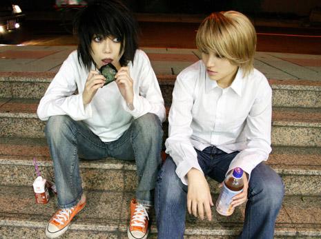 l (death note), yagami light, death note, cosplay photo, lowres, photo (medium), 2boys, alternate hair color, asian, bags under eyes, cosplay, eating, food, male focus, multiple boys, onigiri