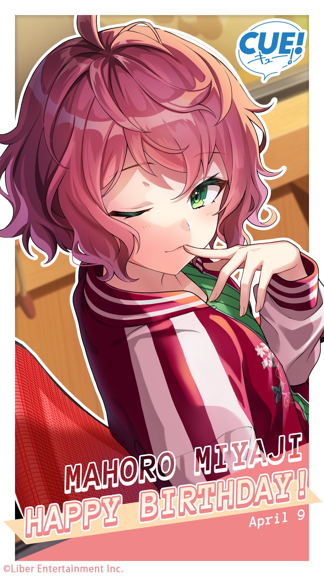 shirako miso, miyaji mahoro, cue!, highres, official art, 1girl, ahoge, blurry, blurry background, blush, breasts, chair, character name, closed mouth, collarbone, dated, english text, from side, green eyes, green shirt, hand on own face, hand up, happy birthday, indoors, jacket, lips, long sleeves, looking at viewer, one eye closed, pink hair, red jacket, shirt, sitting, small breasts, smile, solo, upper body, wavy hair
