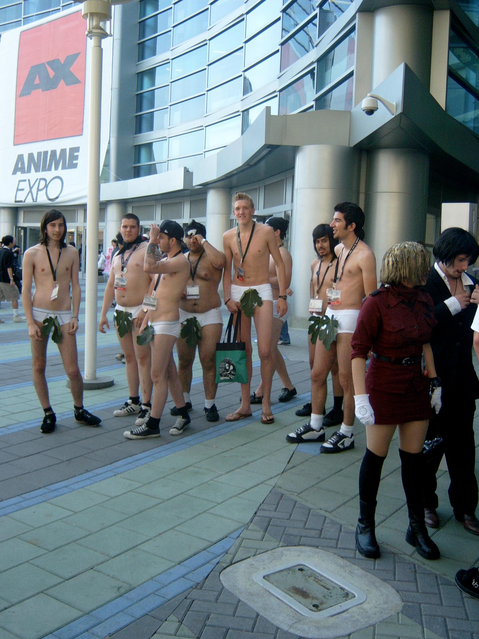 cosplay photo, highres, non-web source, photo (medium), 1girl, 6+boys, axe, cosplay, happatai, leaf, multiple boys, topless female, underwear, weapon, yatta