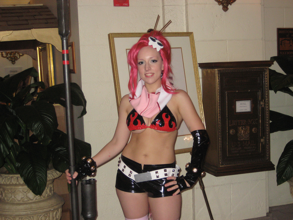 pamelaneko, yoko littner, tengen toppa gurren lagann, cosplay photo, photo (medium), 1girl, bikini, bikini top only, breasts, cosplay, female focus, gloves, gun, long hair, medium breasts, red hair, scarf, solo, swimsuit, thighhighs, weapon