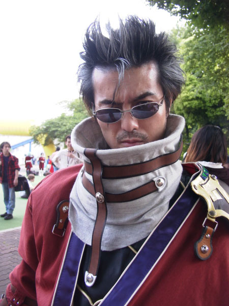 auron, final fantasy, final fantasy x, cosplay photo, photo (medium), 1boy, armor, asian, auron (cosplay), beard, black eyes, black hair, closed mouth, coat, cosplay, day, facial hair, glasses, lips, looking at viewer, male focus, one eye closed, red coat, scar, scar across, scar across eye, scar on face, shoulder pads, solo focus, thick eyebrows, tree, upper body
