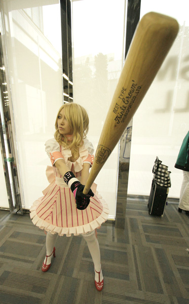 omi gibson, bad girl (no more heroes), grasshopper manufacture, no more heroes, cosplay photo, photo (medium), 1girl, asian, bad girl (cosplay), baseball bat, cosplay, dress, female focus, foreshortening, gloves, high heels, shoes, solo