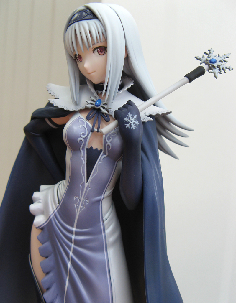 tony taka, blanc neige, sega, shining (series), shining tears, photo (medium), 1girl, armpits, black thighhighs, blue gemstone, breasts, breasts apart, cape, cleavage, cowboy shot, dress, elbow gloves, female focus, figure, figure (medium), gem, gloves, gradient background, grey background, hairband, hand on own hip, high collar, indoors, leaning to the side, legs apart, narrow waist, no bra, parted bangs, red eyes, solo, standing, thighhighs, wand, white hair