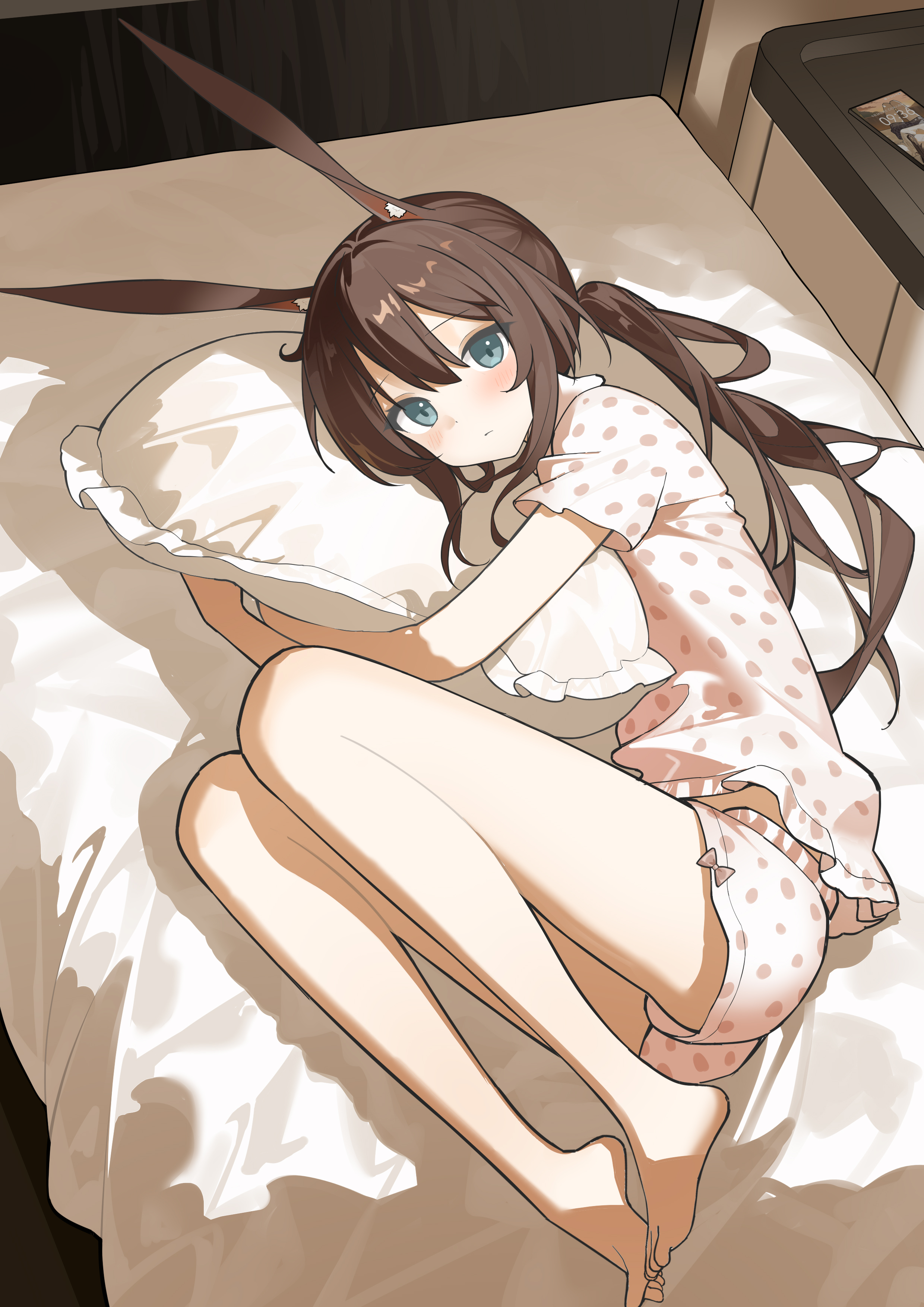 nagisa (cxcx5235), amiya (arknights), arknights, absurdres, highres, 1girl, animal ear fluff, animal ears, barefoot, bed, bed sheet, blue eyes, blush, brown hair, closed mouth, feet, full body, hugging object, indoors, long hair, looking at viewer, lying, on bed, on side, pajamas, pillow, pillow hug, polka dot, polka dot shirt, ponytail, rabbit ears, rabbit girl, shirt, short sleeves, shorts, sidelocks, solo, toes, white shorts