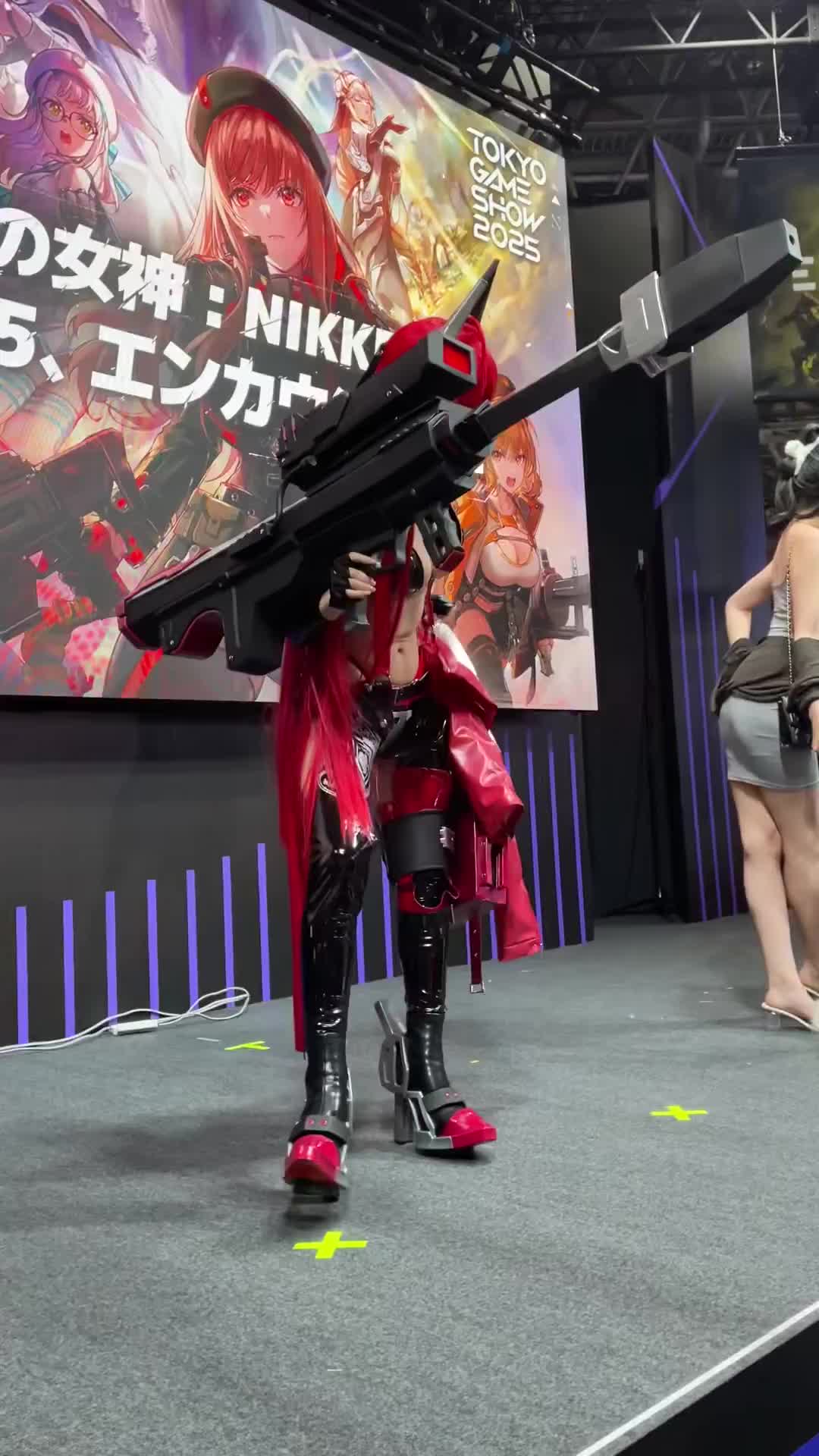 red hood (nikke), goddess of victory: nikke, real life, animated, tagme, video, anti-materiel rifle, barrett m82a2, breasts, bullpup, cleavage, cosplay, gun, navel, official cosplay, red hair, rifle, sniper rifle, weapon