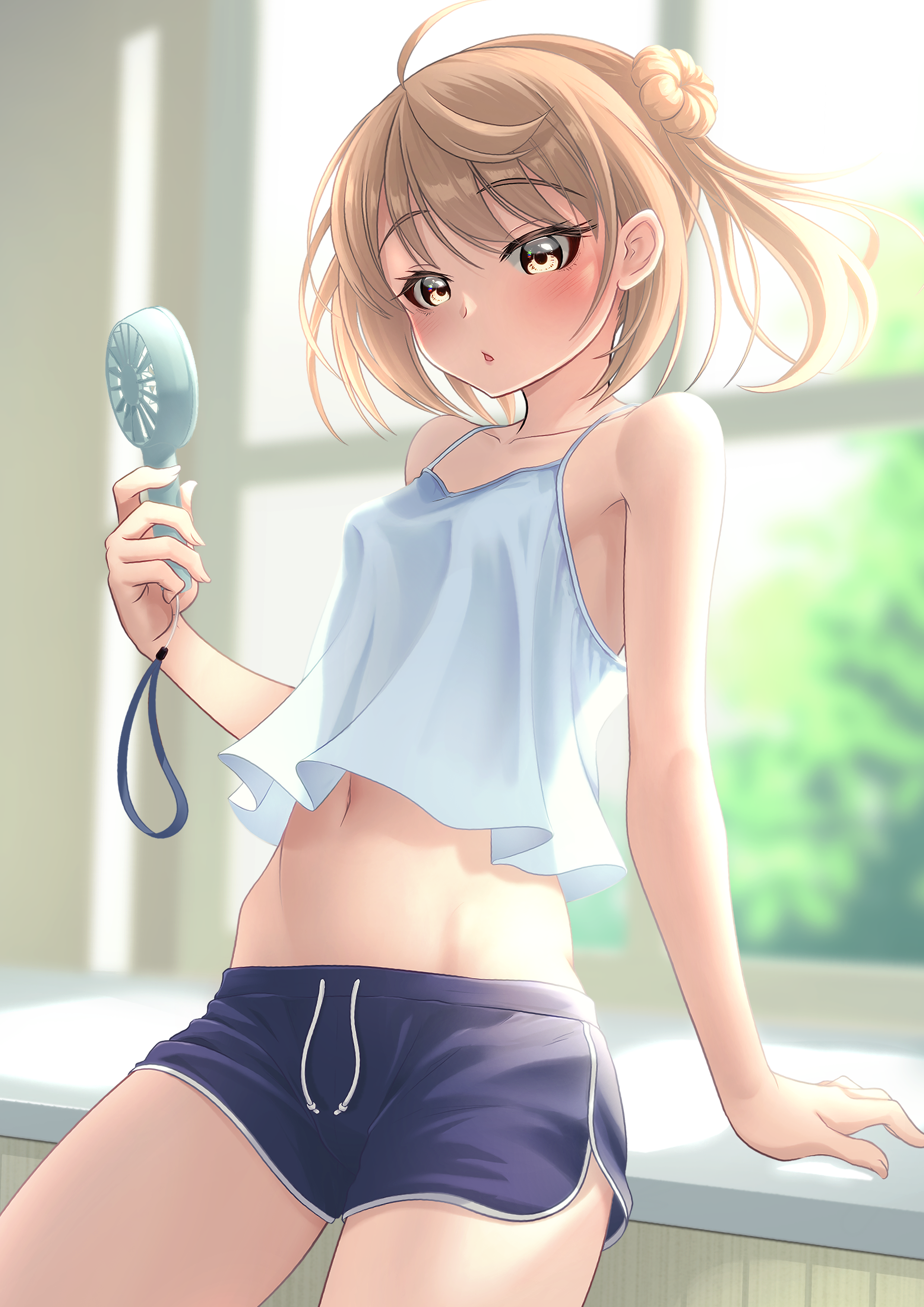 makura (y makura), michishio (kancolle), kantai collection, absurdres, commentary request, highres, 1girl, ahoge, alternate costume, blonde hair, blue shorts, blush, breasts, brown eyes, camisole, collarbone, cowboy shot, crop top, day, dolphin shorts, double bun, drawstring, electric fan, floating hair, hair bun, handheld electric fan, indoors, looking at viewer, medium hair, midriff, navel, open mouth, reclining, short shorts, shorts, sidelocks, small breasts, solo, spaghetti strap, triangle mouth, two side up, white camisole, window
