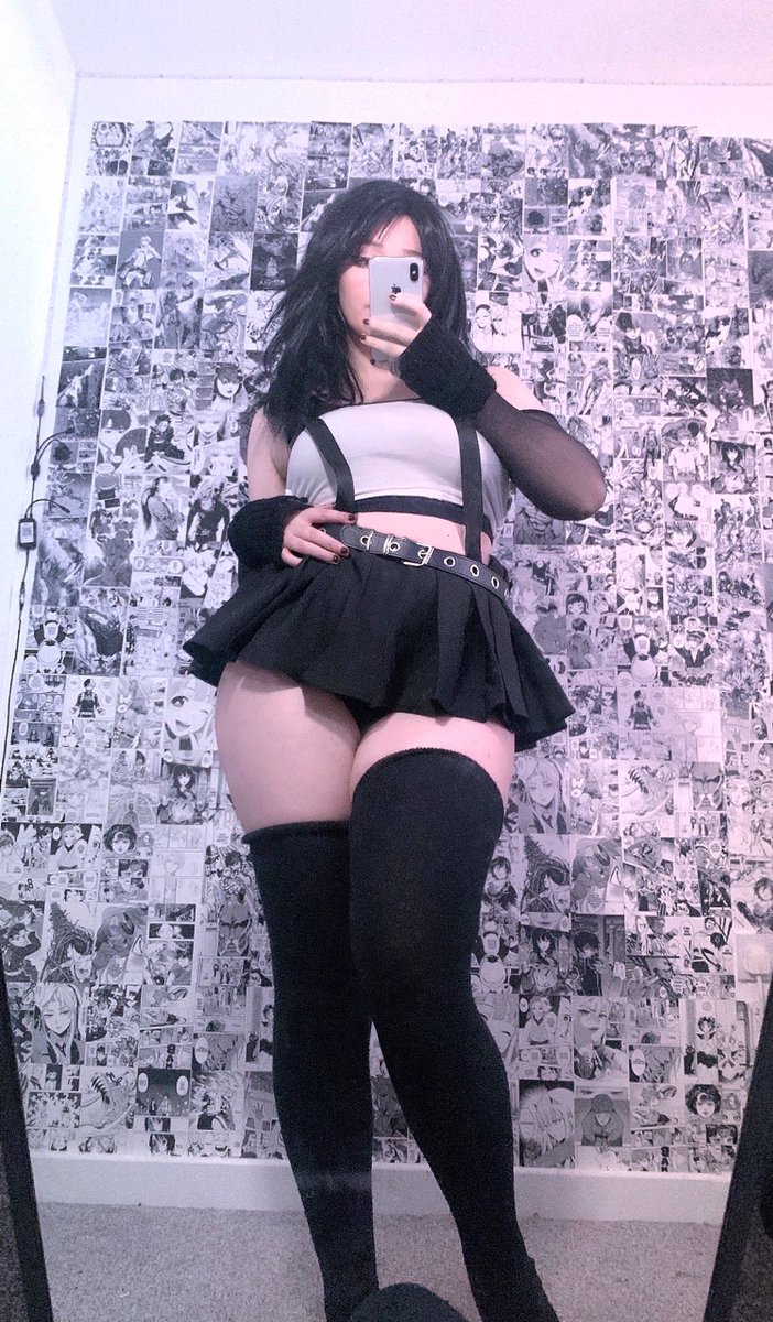 ny4ncy, tifa lockhart, final fantasy, final fantasy vii, final fantasy vii remake, real life, square enix, cosplay photo, photo (medium), 1girl, bare shoulders, black gloves, black hair, black skirt, black thighhighs, cellphone, female focus, gloves, hand on own hip, holding, holding phone, long hair, phone, selfie, skirt, smartphone, solo, suspender skirt, suspenders, thighhighs, tifa lockhart (cosplay)