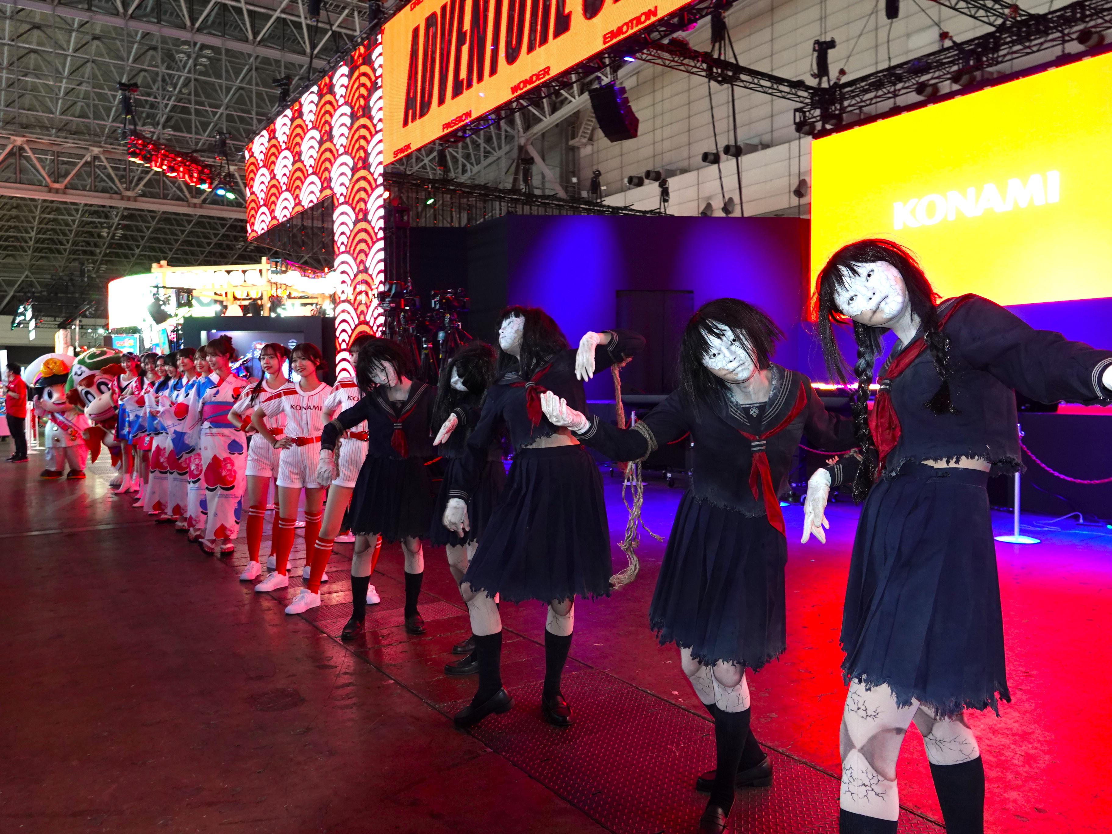ayakakashi, konami, real life, silent hill (series), silent hill f, highres, photo (medium), 6+girls, ayakakashi (cosplay), bent over, black eyes, black hair, black serafuku, black shirt, black skirt, breasts, cosplay, expressionless, full body, japanese (nationality), logo, midriff, multiple girls, navel, neckerchief, photo (object), red neckerchief, rope, rope marks, school uniform, serafuku, shirt, short hair, skirt, torn clothes, torn shirt, torn skirt, underboob