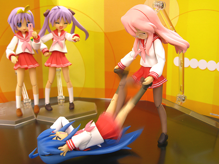 hiiragi kagami, hiiragi tsukasa, izumi konata, takara miyuki, figma, lucky star, photo (medium), > <, 00s, 4girls, = =, ahoge, ball busting, bdsm, blue hair, bullying, camera phone, cbt, cellphone, crotch stomping, cunt punt, denki anma, figure, figure (medium), glasses, laughing, long hair, motion blur, multiple girls, pantyhose, phone, photographic proof, pink hair, purple hair, school uniform, serafuku, short hair, siblings, sisters, stomping, twins, twintails, wrestling