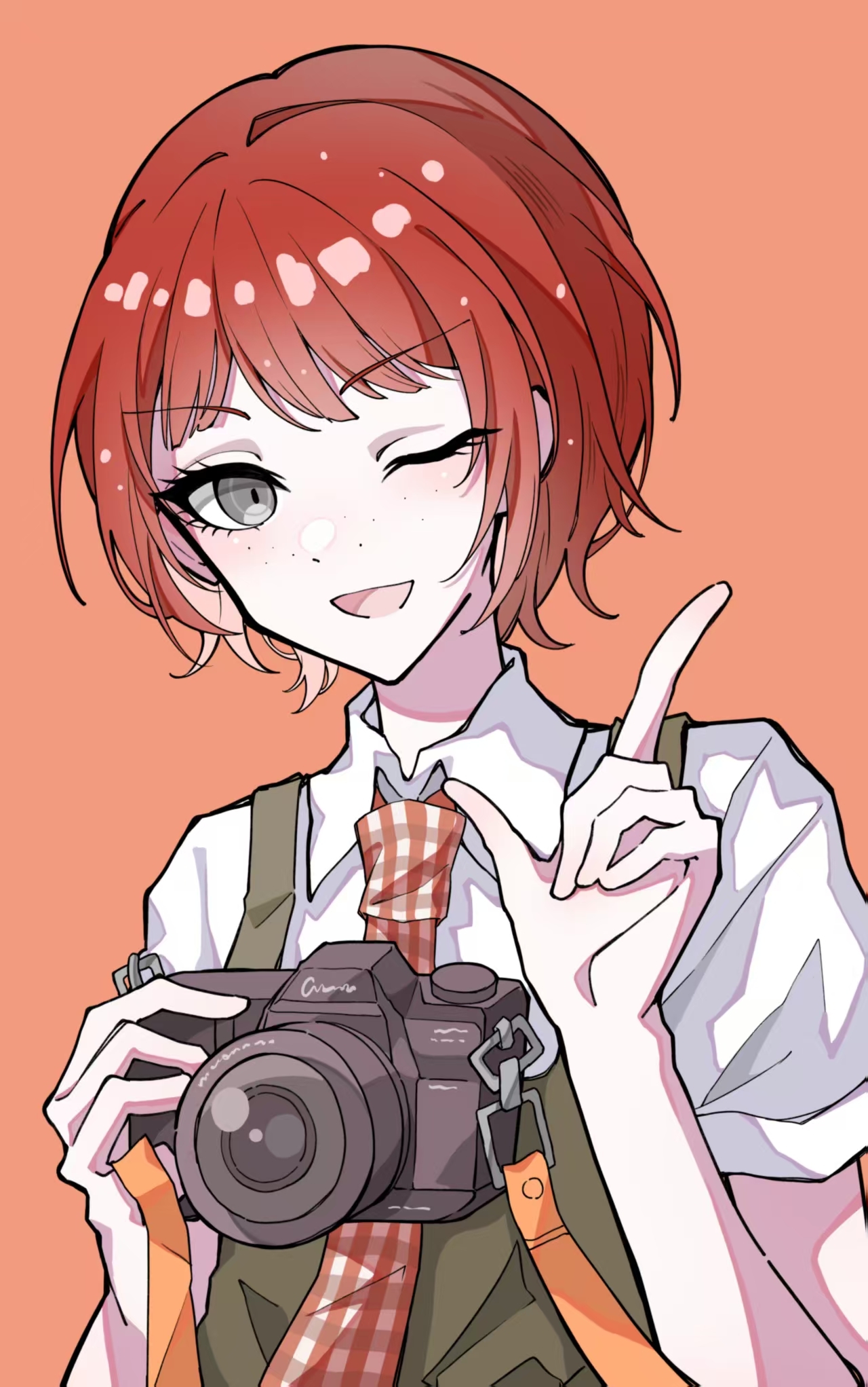 lulutmi, koizumi mahiru, danganronpa (series), danganronpa 2: goodbye despair, commentary, highres, 1girl, camera, collared shirt, dress, eyelashes, freckles, gingham necktie, green dress, grey eyes, holding, holding camera, index finger raised, light blush, looking at viewer, necktie, one eye closed, open mouth, orange background, pinafore dress, plaid clothes, plaid necktie, red hair, shirt, short hair, short sleeves, sleeveless, sleeveless dress, smile, solo, two-tone necktie, upper body, white shirt