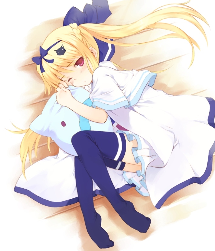 kurasuke, lulli, sakura strasse, 1girl, blonde hair, blush, cat hair ornament, dress, female focus, hair ornament, hair ribbon, hugging object, legs, long hair, lying, one eye closed, pillow, pillow hug, pink eyes, ribbon, sleepy, solo, thighhighs, twintails, wink
