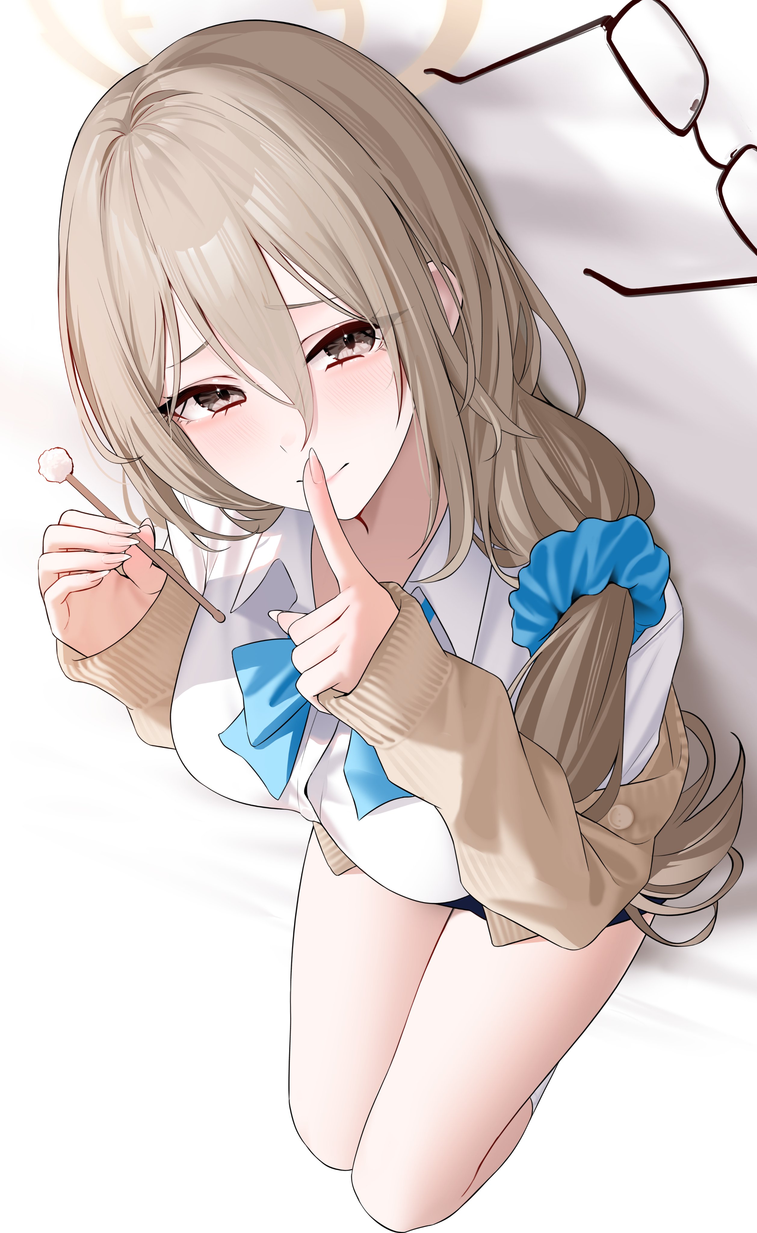 wanne, akane (blue archive), akane (school uniform) (blue archive), blue archive, absurdres, highres, 1girl, black skirt, blue bow, blue bowtie, blue scrunchie, blush, bow, bowtie, breasts, brown cardigan, brown eyes, brown hair, brown halo, cardigan, finger to mouth, glasses, hair between eyes, halo, large breasts, long hair, looking at viewer, lying, mimikaki, scrunchie, shirt, shushing, skirt, socks, solo, thighs, unworn eyewear, white shirt, white socks