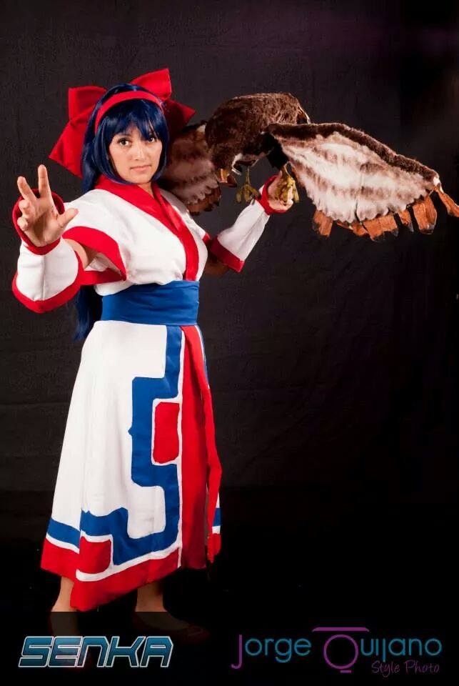 mamahaha, nakoruru, samurai spirits, snk, the king of fighters, 1girl, blue hair, breasts, brown eyes, cosplay, feet, fingerless gloves, gloves, hair ribbon, legs, long hair, looking at viewer, medium breasts, outstretched arm, ribbon, thighs