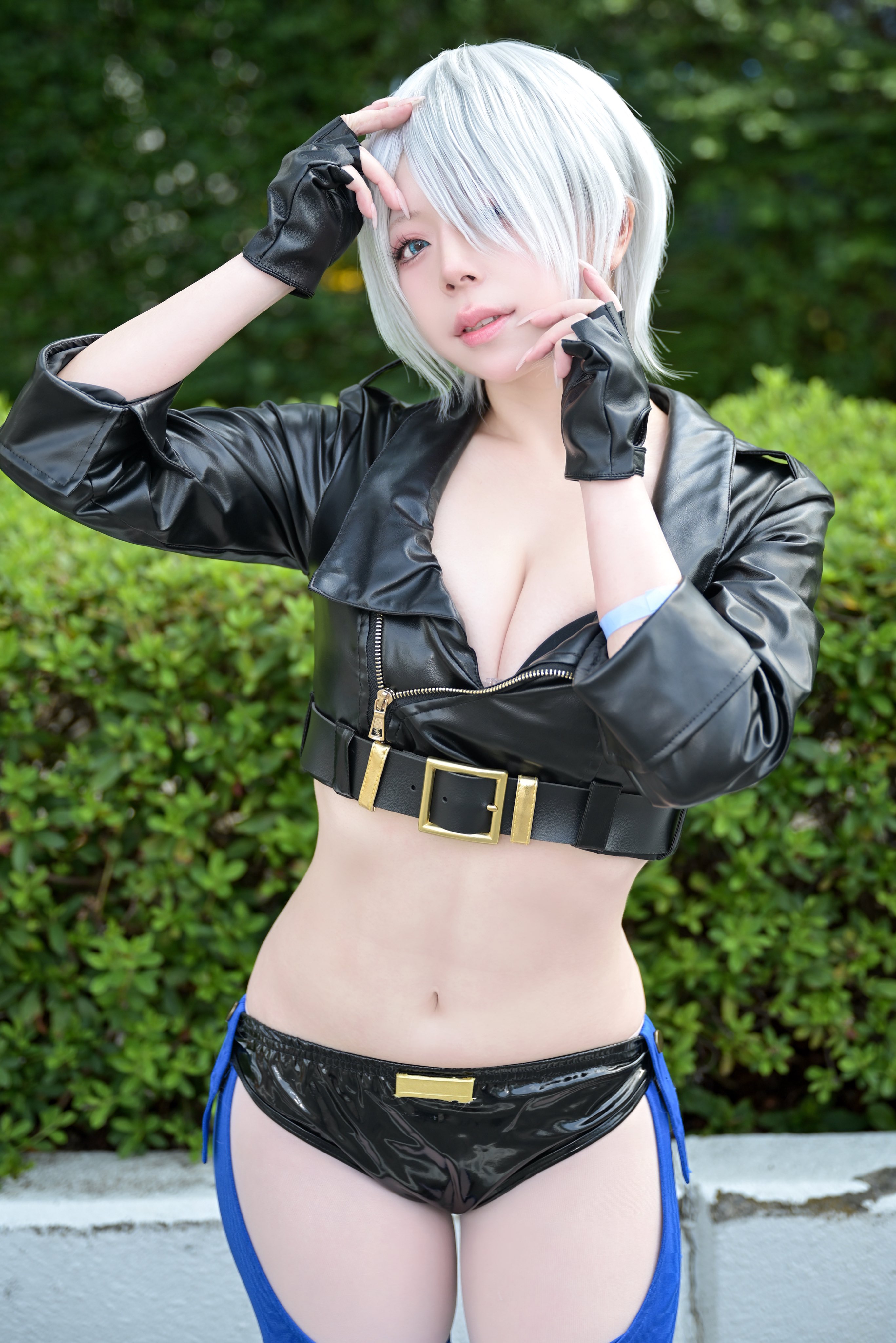 angel (kof), real life, snk, the king of fighters, absurdres, cosplay photo, highres, photo (medium), 1girl, angel (kof) (cosplay), backless pants, black gloves, black jacket, black panties, blue eyes, blurry, blurry background, breasts, cleavage, collarbone, cropped jacket, female focus, fingerless gloves, gloves, hair over one eye, jacket, leather, leather jacket, navel, o tama o, panties, pants, solo, underwear, white hair