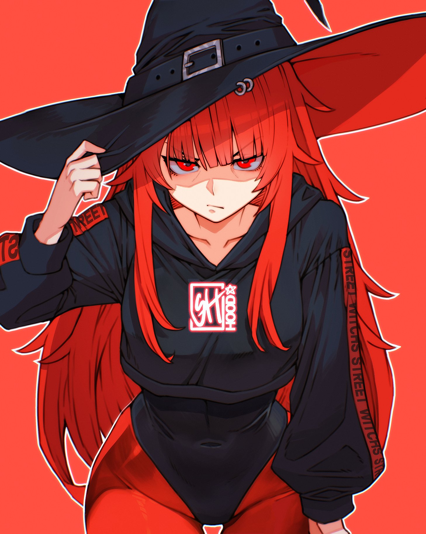 skaggshood, val (yan kodiac), original, commentary, highres, 1girl, adjusting clothes, adjusting headwear, angry, black hat, black hoodie, black leotard, closed mouth, clothes writing, collarbone, covered navel, cowboy shot, cropped hoodie, hat, hood, hoodie, leotard, long hair, looking at viewer, pants, red background, red eyes, red hair, red pants, shaded face, simple background, solo, two-sided fabric, two-sided headwear, v-shaped eyebrows, witch hat