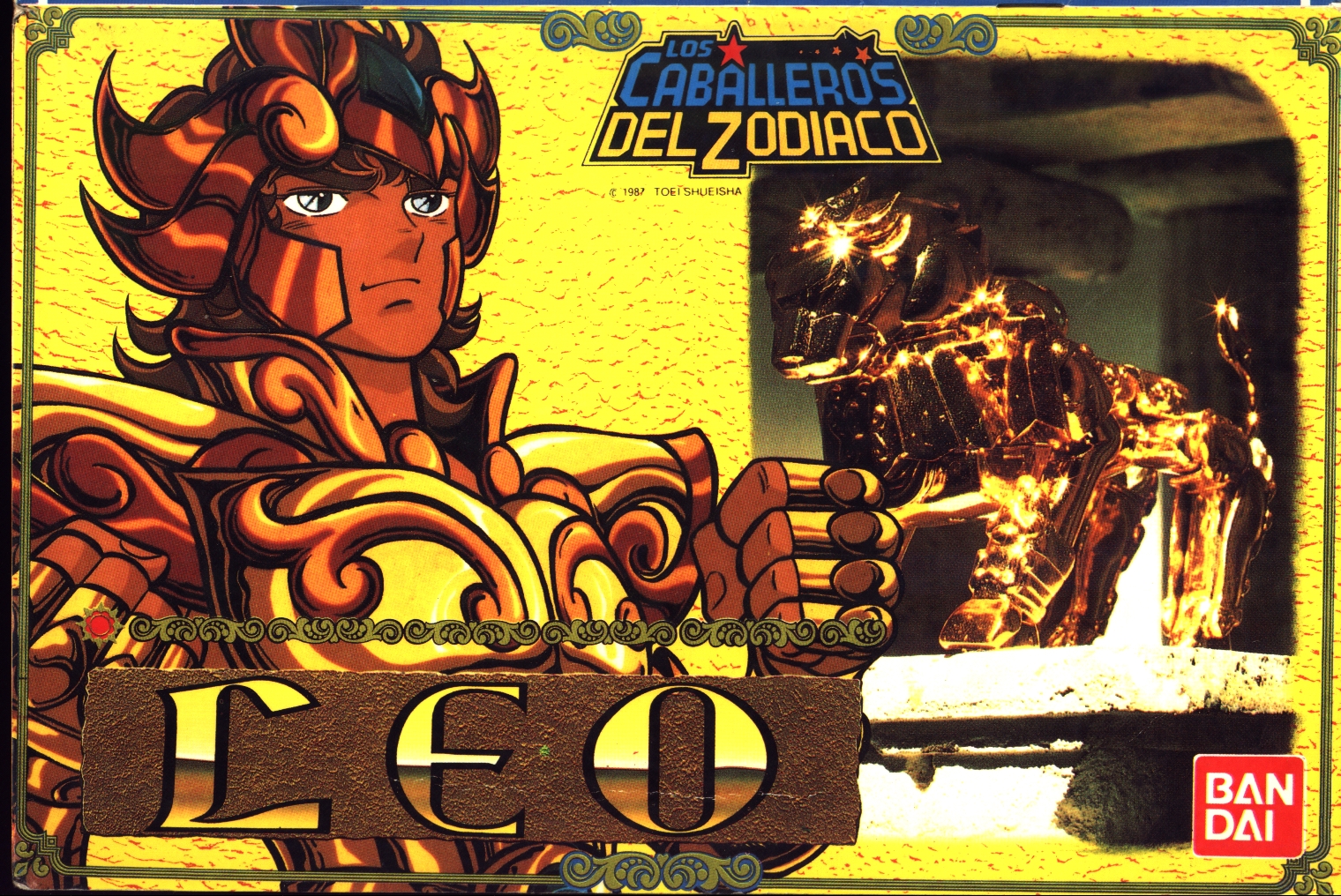 leo aiolia, saint seiya, official art, scan, 1boy, armor, brown hair, clenched hands, cover, figure, fingerless gloves, gloves, helm, helmet, jewelry, lion, male focus, saint seiya figures, shiny clothes, short hair, solo, spanish text, spiked hair, tan