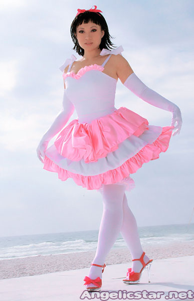 yaya han, kirigoe mima, perfect blue, photo (medium), 1girl, angelicstar, beach, black hair, bow, cloud, cosplay, dress, female focus, full body, gloves, high heels, ocean, outdoors, photo shoot, pink bow, pink dress, red shoes, ribbon, shoes, short hair, skirt, sky, solo, standing, thighhighs, white dress, white gloves