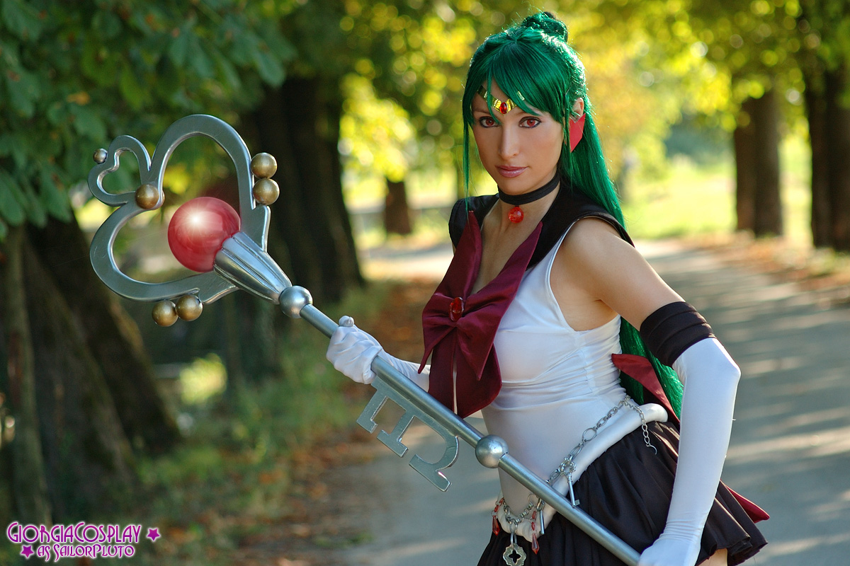 meiou setsuna, sailor pluto, bishoujo senshi sailor moon, photo (medium), boots, bow, cosplay, gloves, green hair, long hair, miniskirt, photo shoot, red eyes, school uniform, serafuku, skirt, staff, tiara, white gloves