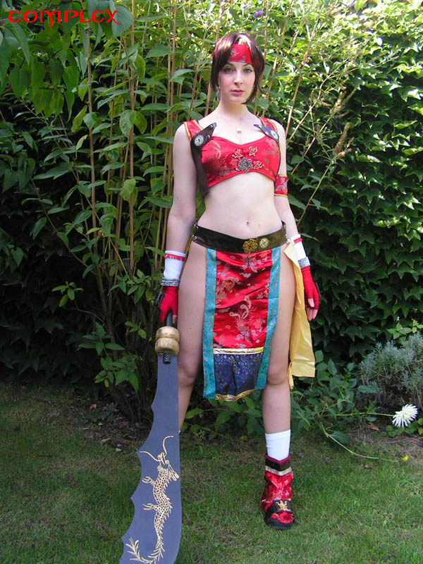 seong mi-na, soul calibur, soulcalibur, soulcalibur ii, photo (medium), 1girl, brown hair, cosplay, female focus, fingerless gloves, gloves, long hair, outdoors, red shoes, seong mi-na (cosplay), shoes, solo, weapon