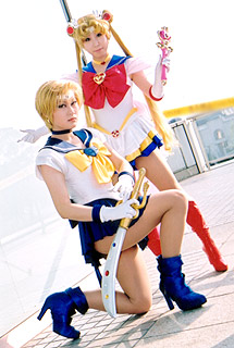 sailor moon, sailor uranus, ten'ou haruka, tsukino usagi, bishoujo senshi sailor moon, lowres, photo (medium), 2girls, asian, blonde hair, boots, cosplay, high heels, long hair, multiple girls, school uniform, serafuku, shoes, short hair, sword, twintails, wand, weapon