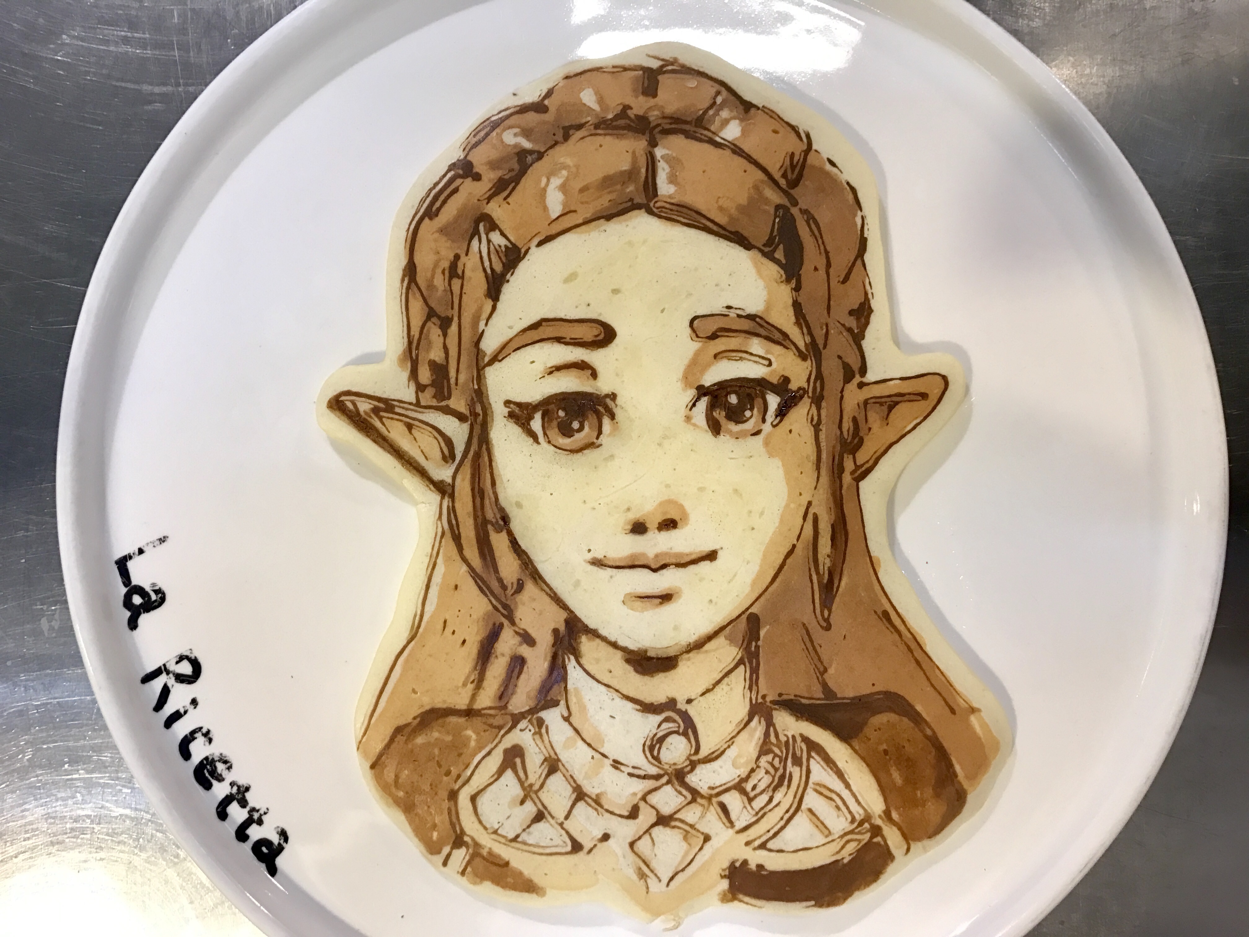 princess zelda, nintendo, the legend of zelda, absurdres, commentary request, food art (medium), highres, photo (medium), unconventional media, 1girl, elf, food, la ricetta, light smile, pancake, pointy ears, solo