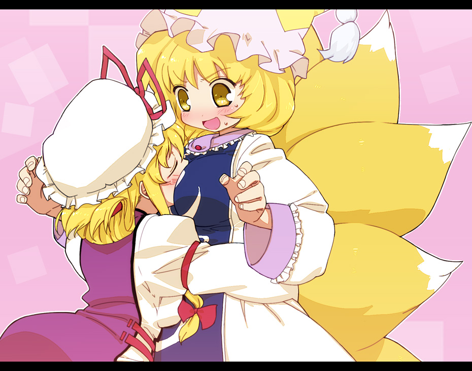 tonbi, yakumo ran, yakumo yukari, touhou, bad id, bad pixiv id, 2girls, animal hat, blonde hair, blush, breast biting, breast smother, breasts, brown eyes, closed eyes, face to breasts, female focus, glomp, hat, hug, large breasts, long sleeves, mob cap, multiple girls, multiple tails, open mouth, pink background, short hair, tail, tassel, wide sleeves, yuri