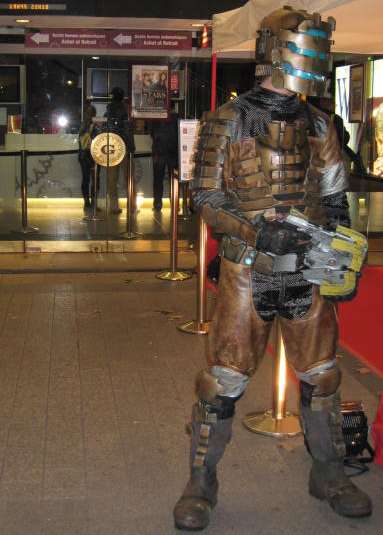 isaac clarke, dead space (series), dead space 1, photo (medium), 1boy, armor, cosplay, gun, male focus, power armor, power suit, science fiction, solo, weapon