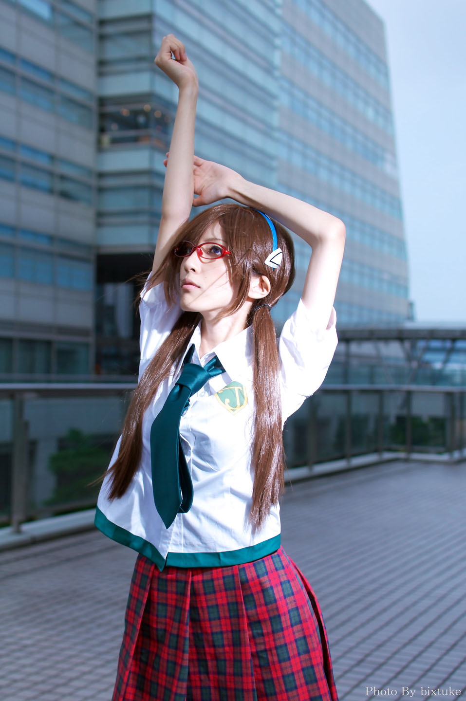 makinami mari illustrious, evangelion: 2.0 you can (not) advance, neon genesis evangelion, rebuild of evangelion, cosplay photo, highres, non-web source, photo (medium), arms up, brown hair, cosplay, glasses, hairband, long hair, necktie, plaid clothes, plaid skirt, school uniform, skirt, solo, twintails