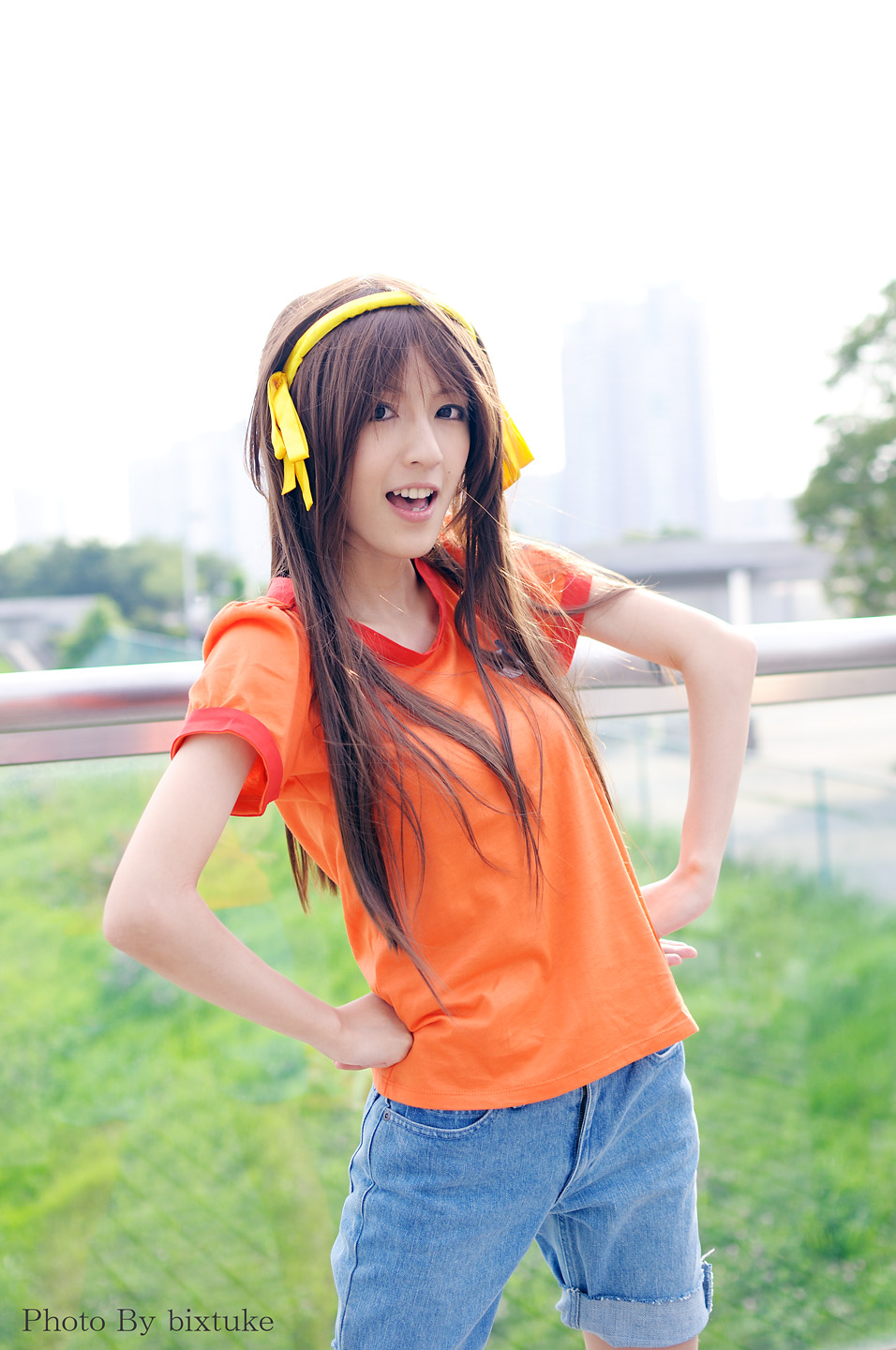 suzumiya haruhi, suzumiya haruhi (young), suzumiya haruhi no yuuutsu, cosplay photo, highres, photo (medium), 1girl, aged down, cosplay, female focus, hairband, orange shirt, shirt, solo