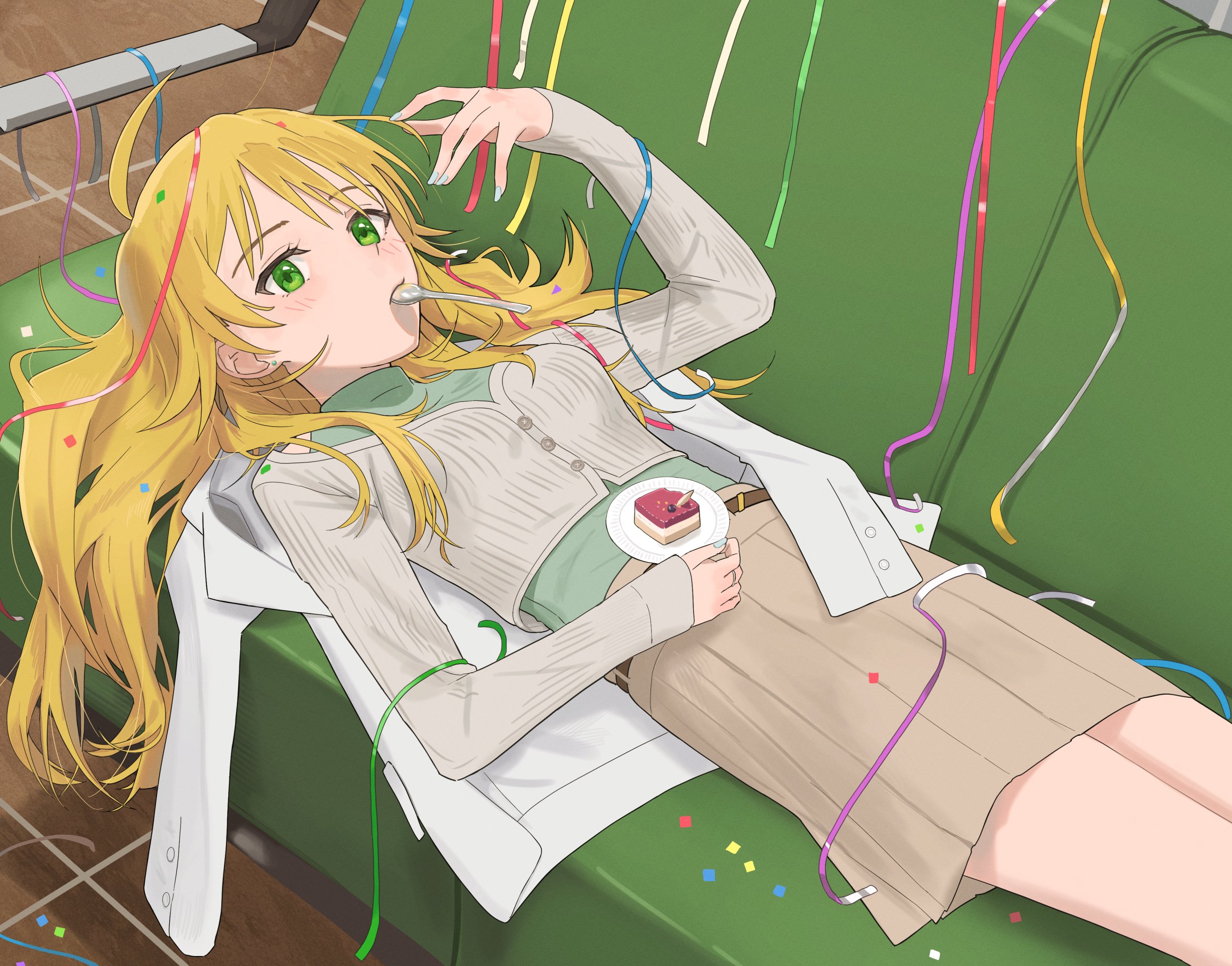 epitaph (1122), hoshii miki, idolmaster, idolmaster (classic), idolmaster million live!, idolmaster million live! theater days, highres, 1girl, ahoge, belt, blonde hair, blue nails, blush, brown belt, brown skirt, cake, cardigan, confetti, couch, cropped cardigan, eyelashes, food, green eyes, green shirt, grey cardigan, happy birthday, jacket, light blush, long hair, long sleeves, looking at viewer, lying, lying on clothes, midriff peek, on couch, pleated skirt, shirt, skirt, sleeves past wrists, solo, spoon, tile floor, tiles, turtleneck, unworn jacket, utensil in mouth