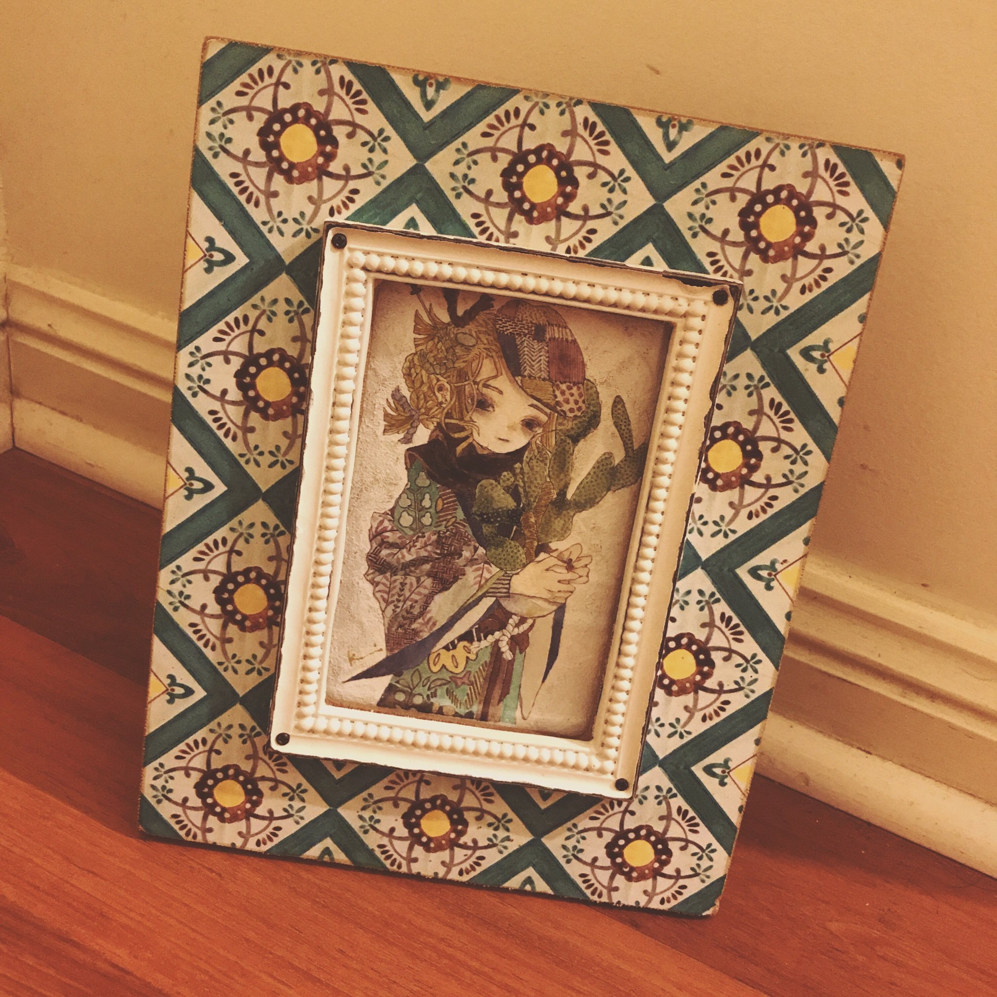 karintoun, patchwork, original, acrylic paint (medium), commentary request, highres, painting (medium), photo (medium), traditional media, watercolor (medium), 1girl, beret, blonde hair, braid, brown eyes, brown hair, cactus, closed mouth, expressionless, flower, hat, holding, holding flower, indoors, japanese clothes, kimono, looking at viewer, medium hair, muted color, picture frame, plant, portrait, scarf, short hair, sidelocks, signature, simple background, straight-on, upper body