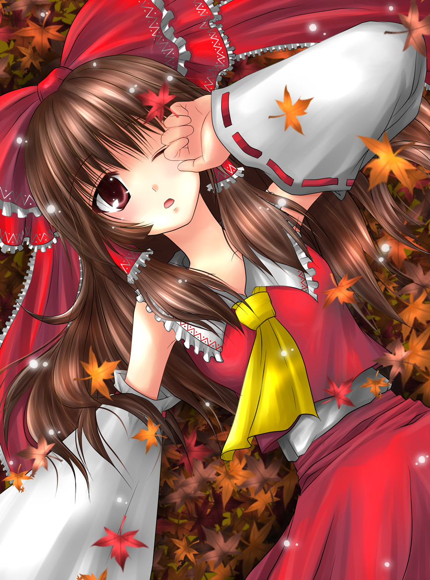 kamiya chiaki, hakurei reimu, touhou, bad id, bad pixiv id, 1girl, black hair, bow, brown hair, detached sleeves, female focus, frills, hair bow, japanese clothes, large bow, leaf, long hair, lying, maple leaf, miko, on back, open mouth, outdoors, red eyes, short hair, solo, wink