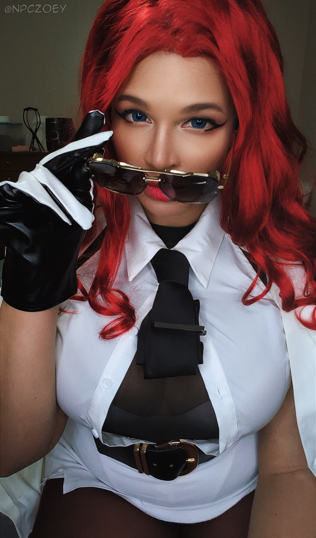 npczoey, crimson viper, capcom, real life, street fighter, street fighter 6, cosplay photo, photo (medium), 1girl, artist name, black gloves, black necktie, breasts, closed mouth, coat, cosplay, crimson viper (cosplay), dark-skinned female, dark skin, female focus, gloves, large breasts, long hair, looking at viewer, multicolored gloves, necktie, red hair, red lips, smile, solo, twitter username, two-tone gloves, white coat