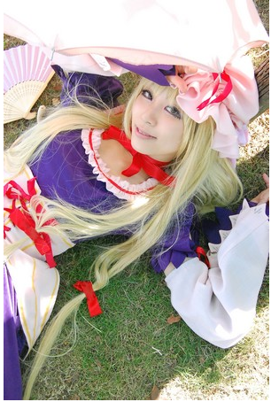 yakumo yukari, touhou, cosplay photo, lowres, photo (medium), blonde hair, bow, cosplay, female focus, hat, solo, yakumo yukari (cosplay)