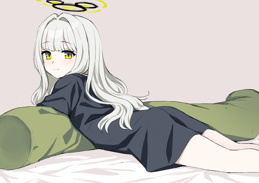 kumadano, hare (blue archive), hare (pajamas) (blue archive), blue archive, 1girl, ass, black shirt, blush, body pillow, green eyes, grey background, hair intakes, halo, long hair, looking back, lying, naked shirt, on stomach, oversized clothes, oversized shirt, pillow, shirt, solo, t-shirt, white hair