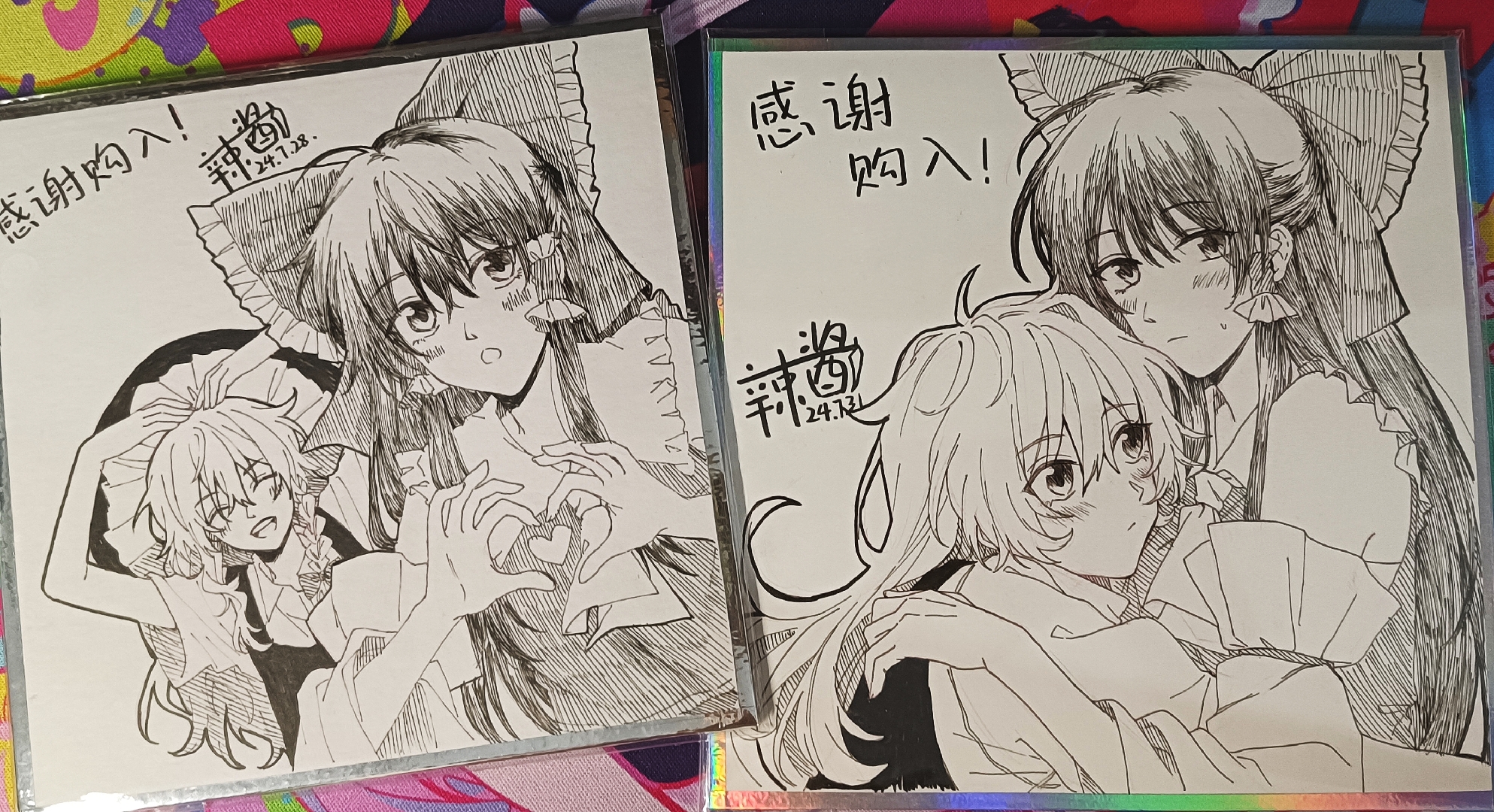 hitte5416, hakurei reimu, kirisame marisa, touhou, chinese commentary, commentary request, highres, photo (medium), traditional media, translation request, 2girls, ascot, blush, bow, braid, chinese text, closed eyes, closed mouth, dated, detached sleeves, facing viewer, frilled bow, frilled hair tubes, frills, hair bow, hair tubes, hat, heart, heart arms, heart hands, hug, long hair, multiple girls, no headwear, open mouth, side braid, single braid, teeth, upper teeth only, witch hat, yuri