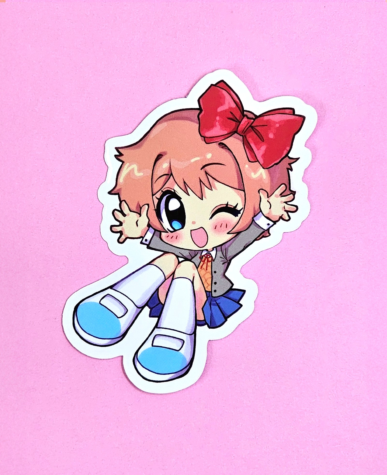 oceaninspace, sayori (doki doki literature club), doki doki literature club, commentary, english commentary, highres, merchandise available, official art, 1girl, ;d, blazer, blue eyes, blue skirt, blush, bow, chibi, chibi only, doki doki literature club school uniform, eyelashes, full body, grey jacket, hair bow, jacket, long sleeves, neck ribbon, one eye closed, open clothes, open jacket, open mouth, orange sweater vest, outline, pink hair, red bow, red ribbon, ribbon, school uniform, shoes, short hair, sitting, skirt, smile, socks, solo, sticker (medium), sweater vest, white outline, white shoes, white socks