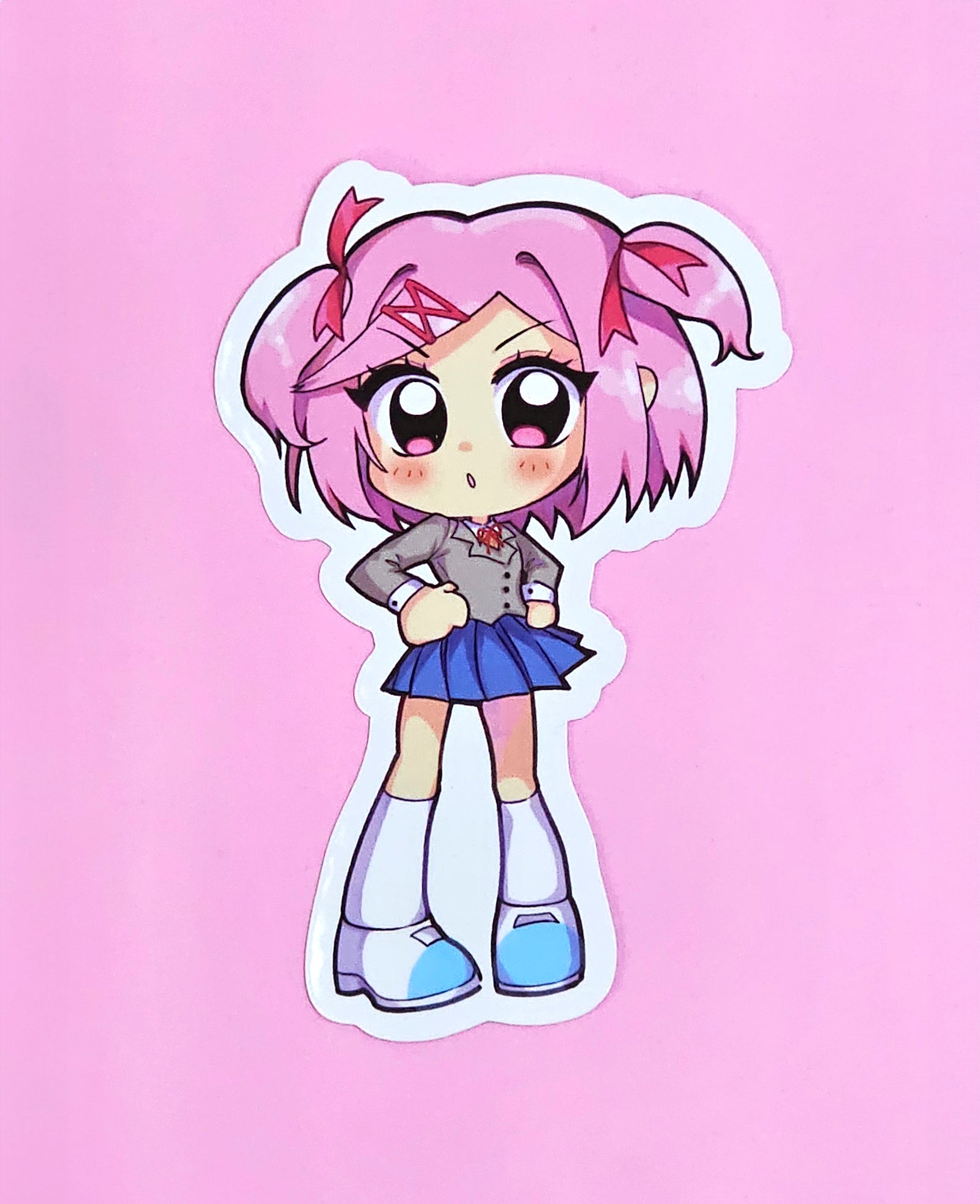 oceaninspace, natsuki (doki doki literature club), doki doki literature club, commentary, english commentary, highres, merchandise available, official art, 1girl, :o, blazer, blue skirt, blush, chibi, chibi only, doki doki literature club school uniform, eyelashes, full body, grey jacket, hair intakes, hair ornament, hair ribbon, hairclip, hands on own hips, jacket, long sleeves, neck ribbon, open mouth, outline, pink eyes, pink hair, red ribbon, ribbon, school uniform, shoes, short hair, skirt, socks, solo, standing, sticker (medium), two side up, white outline, white shoes, white socks